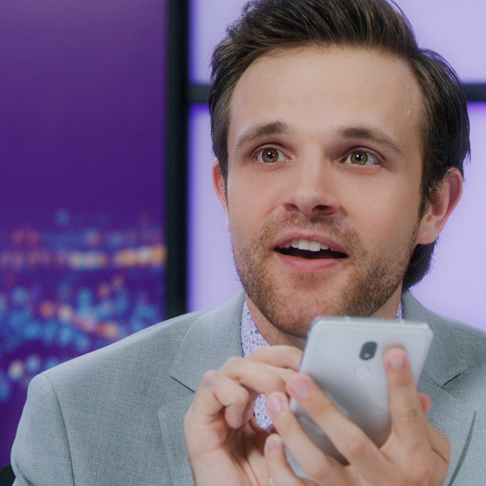 Actor playing a news anchor for a wireless company commercial