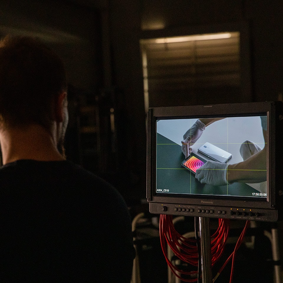 A video monitor on the set of a product promo video shoot