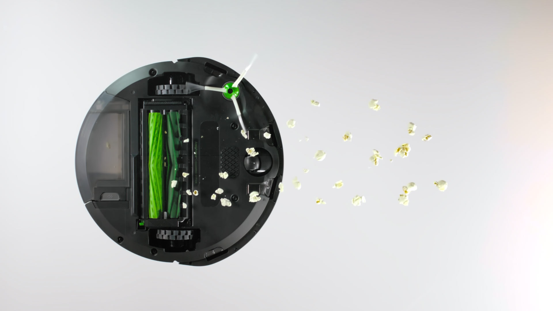 A color graded shot of a robot vacuum in a product demo commercial