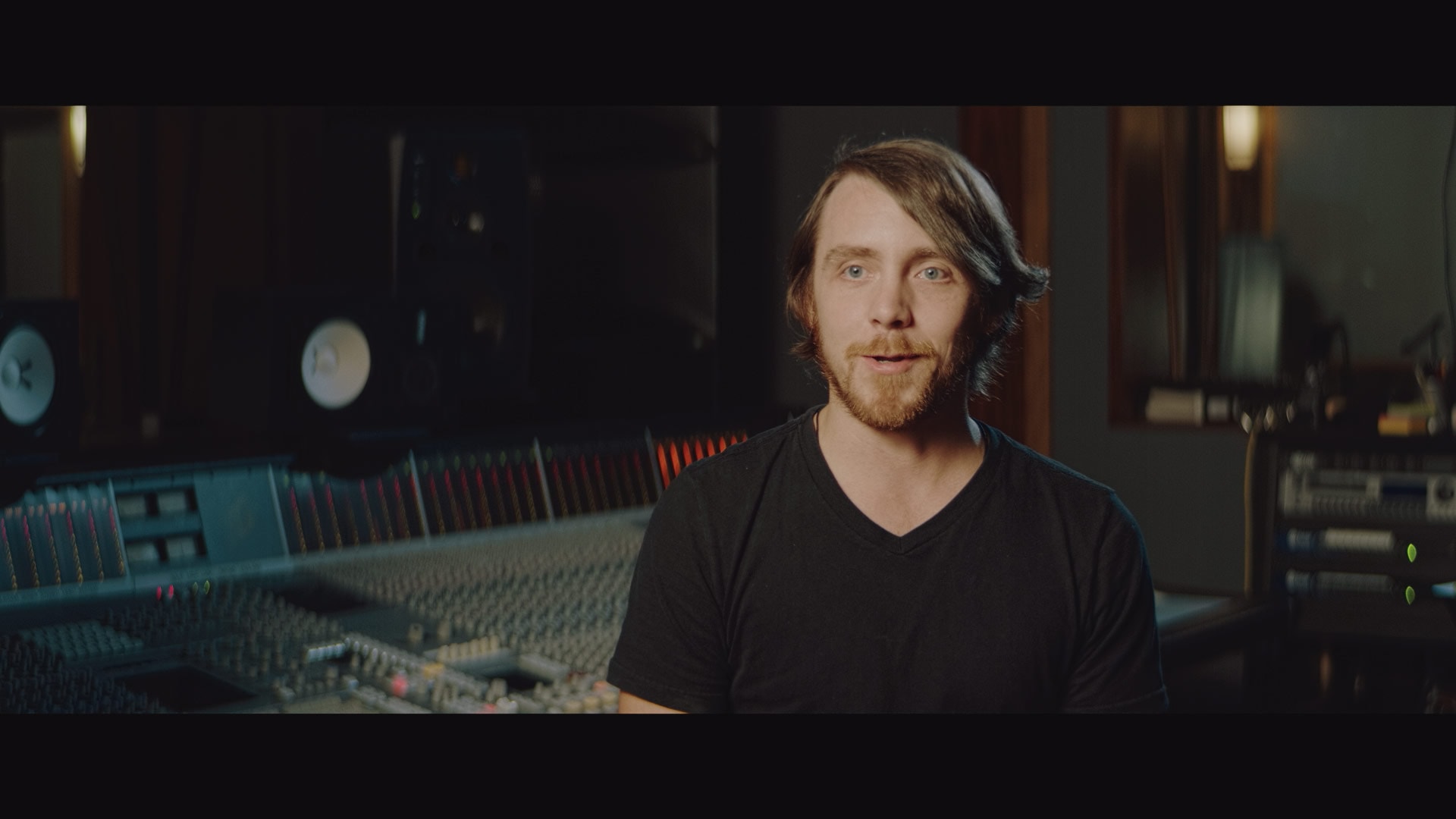 A musician in the studio in a branded documentary video