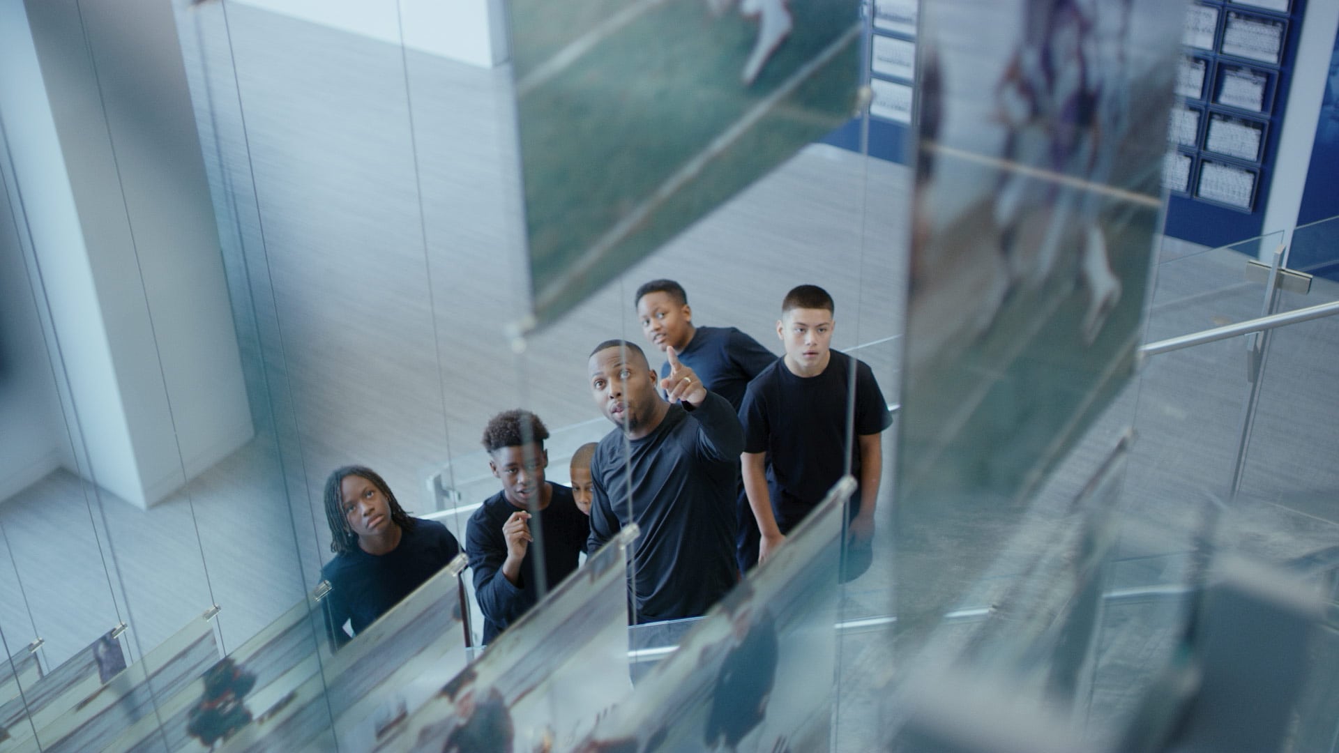 A shot of a coach and players from a branded documentary style video