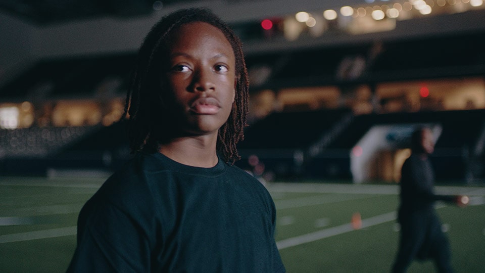 A shot of a football player from a branded documentary style video