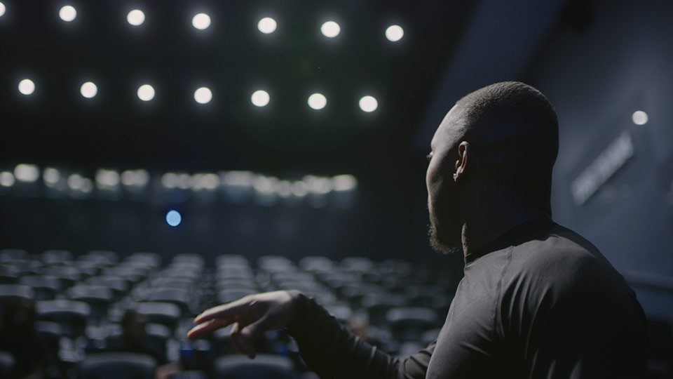 A shot of a football coach from a branded documentary style video